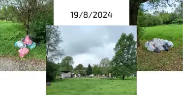 Vreče smeti odvržene na travi pri drevesih v parku